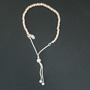 Elegant Silver and Cream Beaded Bracelet